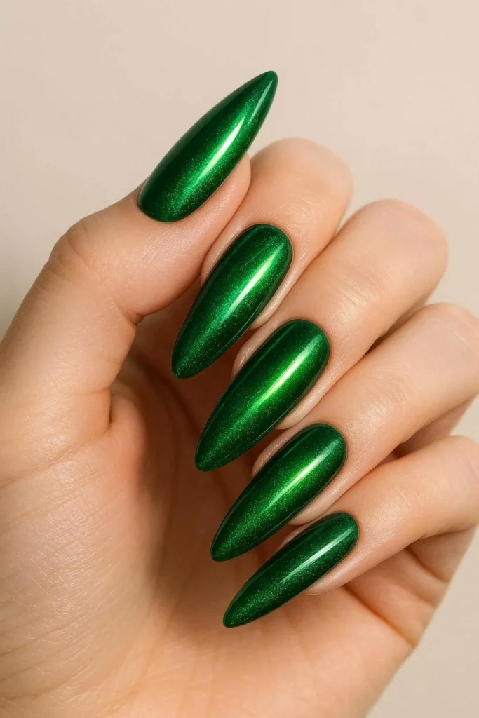  Emerald green cat eye nails with magnetic shimmer on almond shape