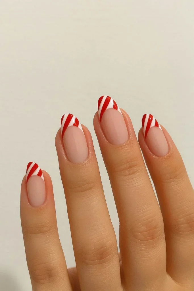 French tip nails with candy cane stripe accents