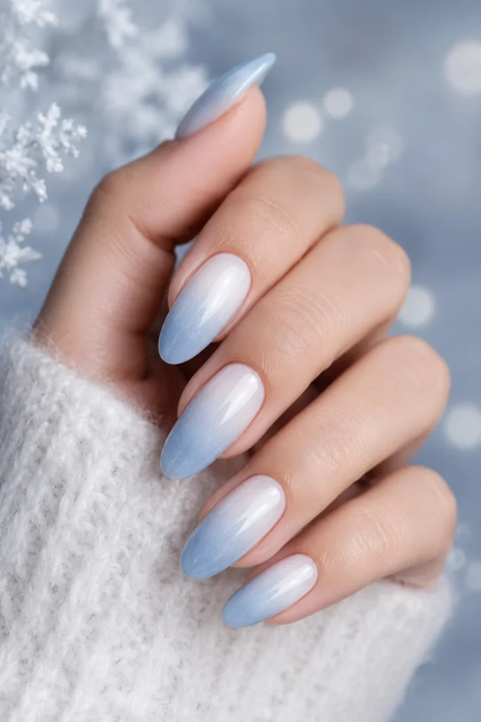 Frosted white to icy blue ombre gradient nail design