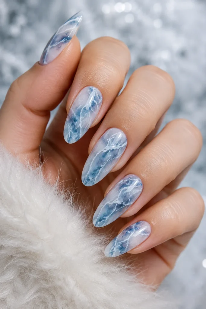 Blue and white frozen marble nail art inspired by ice formations