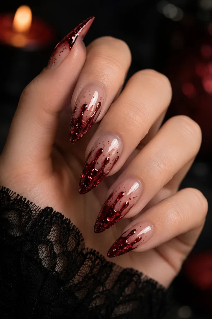 Red glitter blood drip nails over sheer nude base
