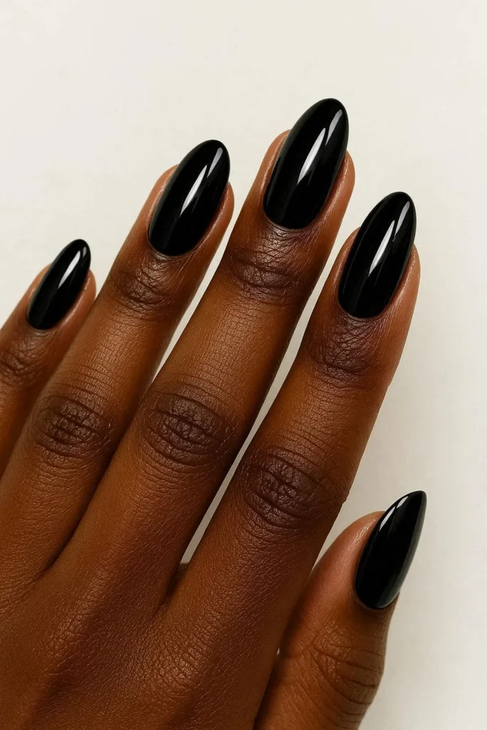 Glossy black fall nails dramatic finish brown skin tones