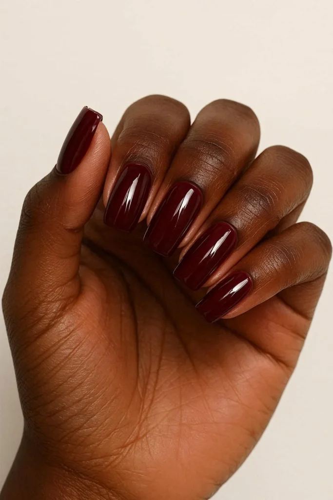 Glossy burgundy fall nails for Black women autumn look