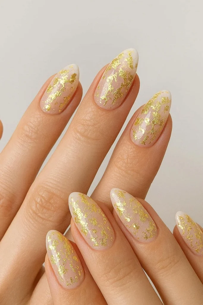 Gold foil accents on soft pink white bridal nails