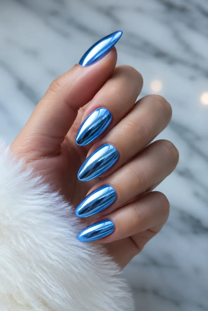 Icy blue chrome mirror nails with a shimmering metallic finish
