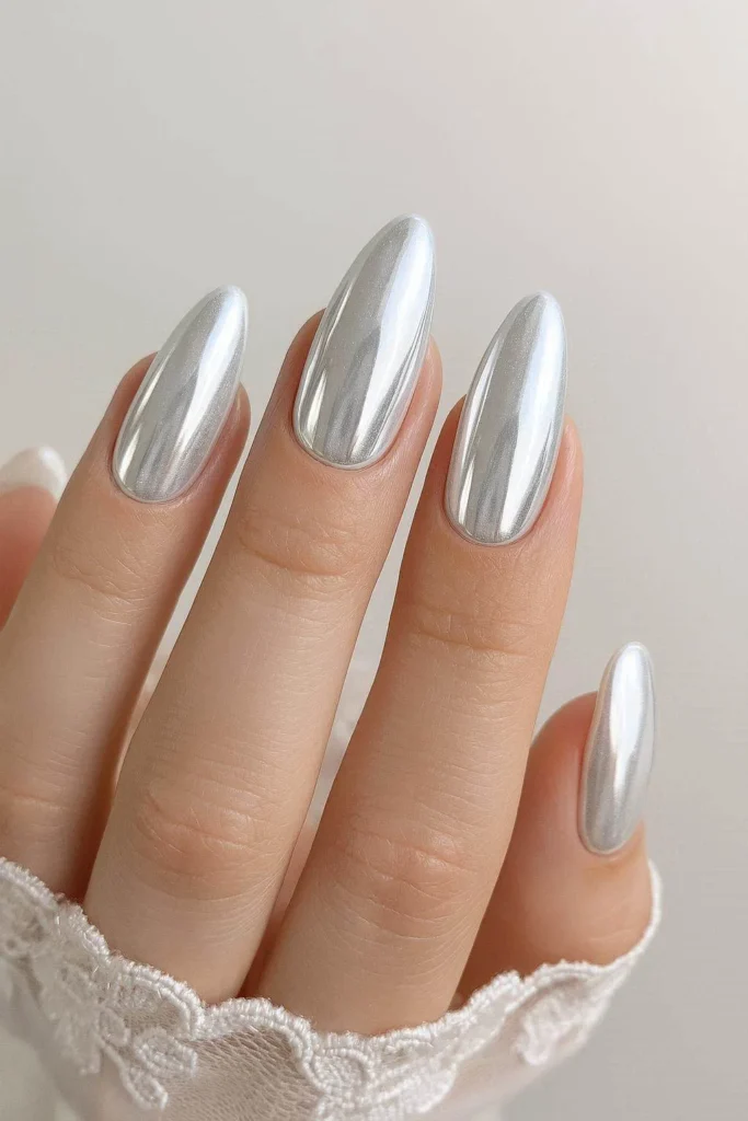 Icy white chrome nails for a modern winter wedding bride