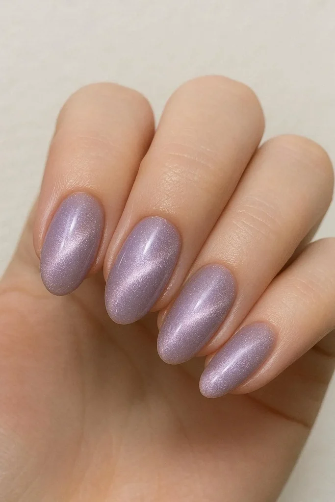 Lavender shimmer cat eye nails with silver pink glow on oval shape 