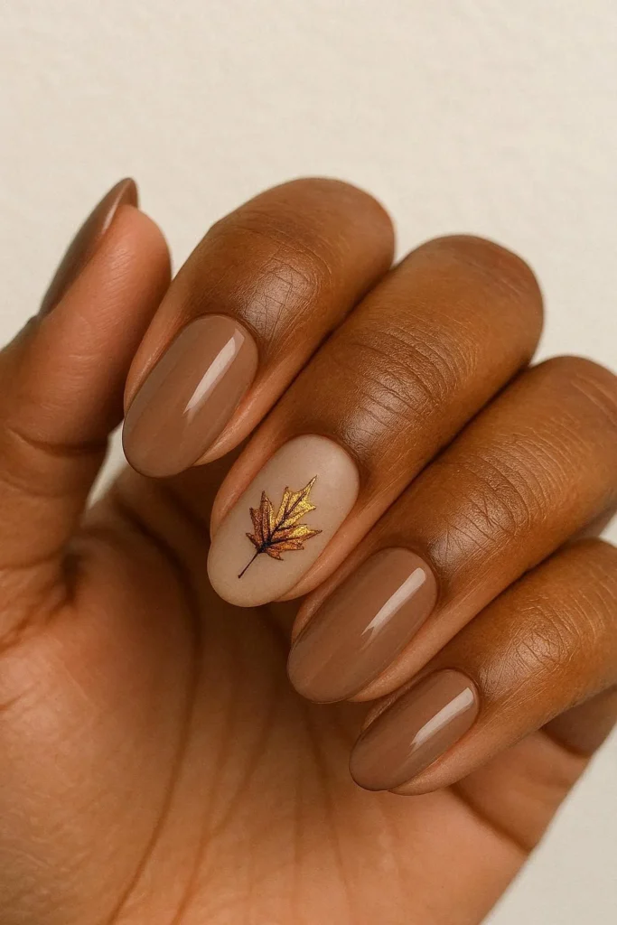 Autumn leaf accent nail art warm tones neutral base 
