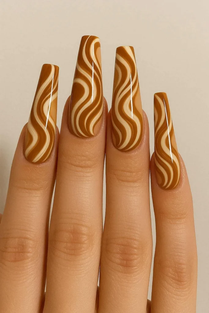Long coffin caramel swirl nails bold autumn design