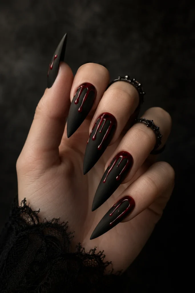Matte black nails with glossy red blood drip tips