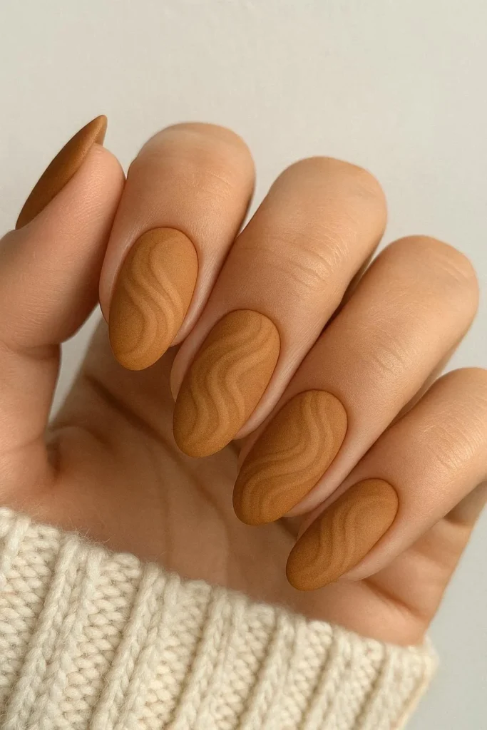 Matte caramel swirl nails with a velvety autumn finish
