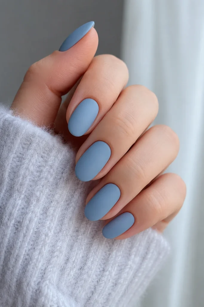 Velvety matte frost blue nails with a soft powdery finish
