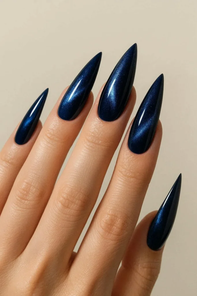 Midnight blue cat eye nails with cobalt silver shimmer on stiletto shape 