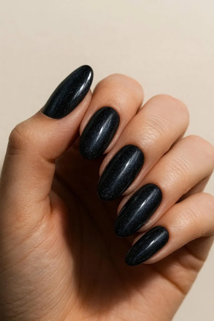 Midnight stage nails glossy black with shimmer and sparkle