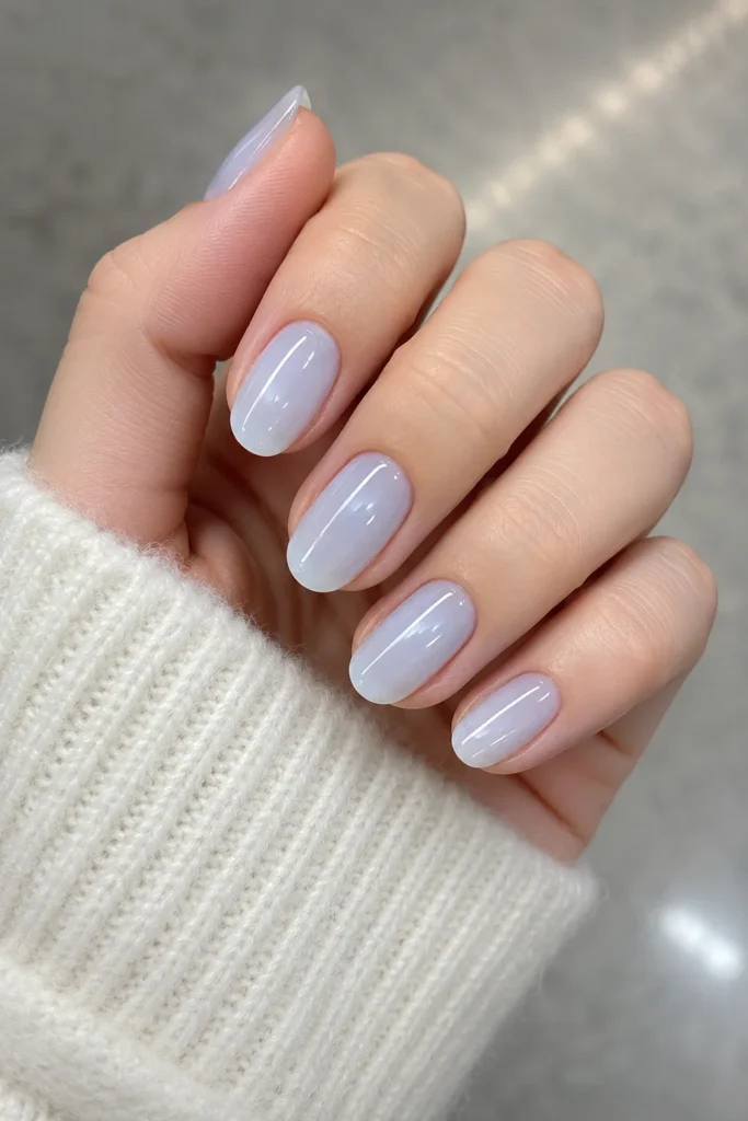 Semi-sheer milky icy blue nails with a glossy finish
