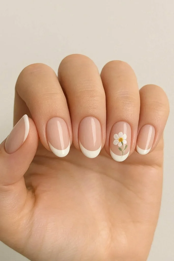 Minimal French tips with single floral statement accent nail
