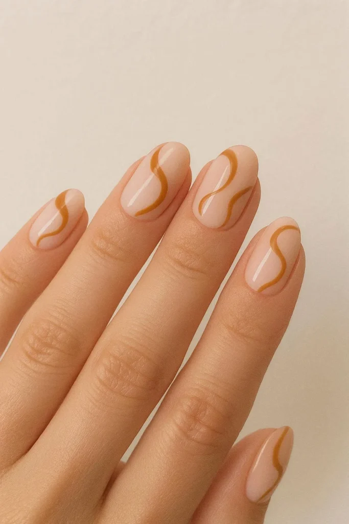 Nude and caramel abstract swirl nails minimalist design