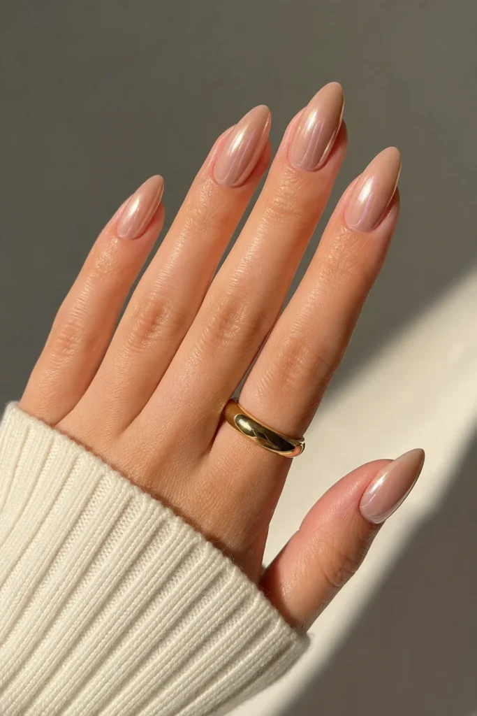 Nude chrome almond nails neutral reflective subtle metallic finish