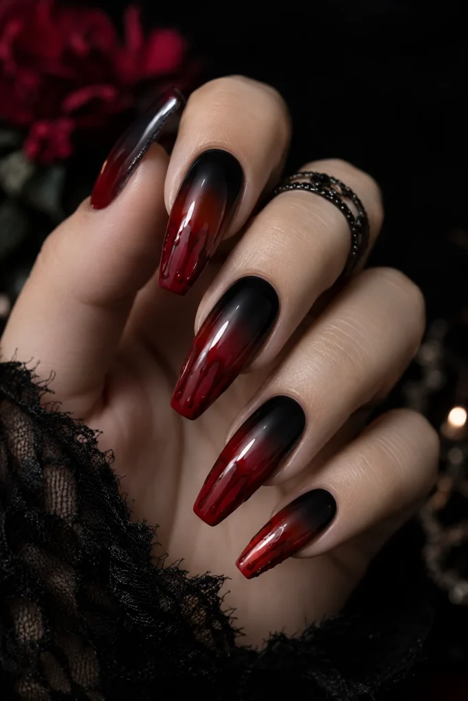 Black to red ombre nails with blood drip artwork