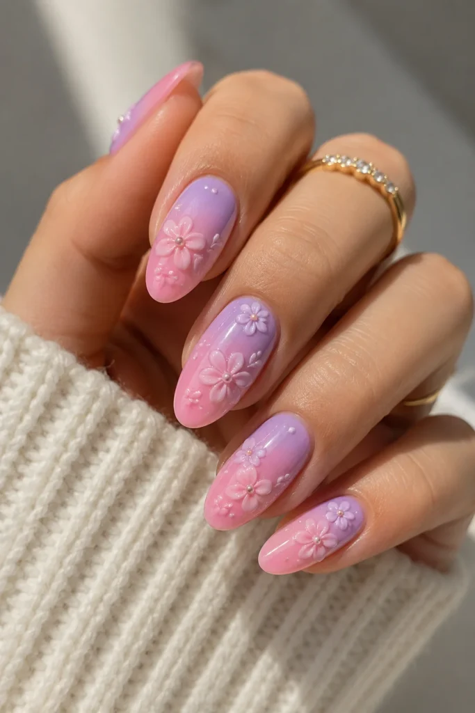 Pastel ombre flower nails with gradient base and raised 3D floral art