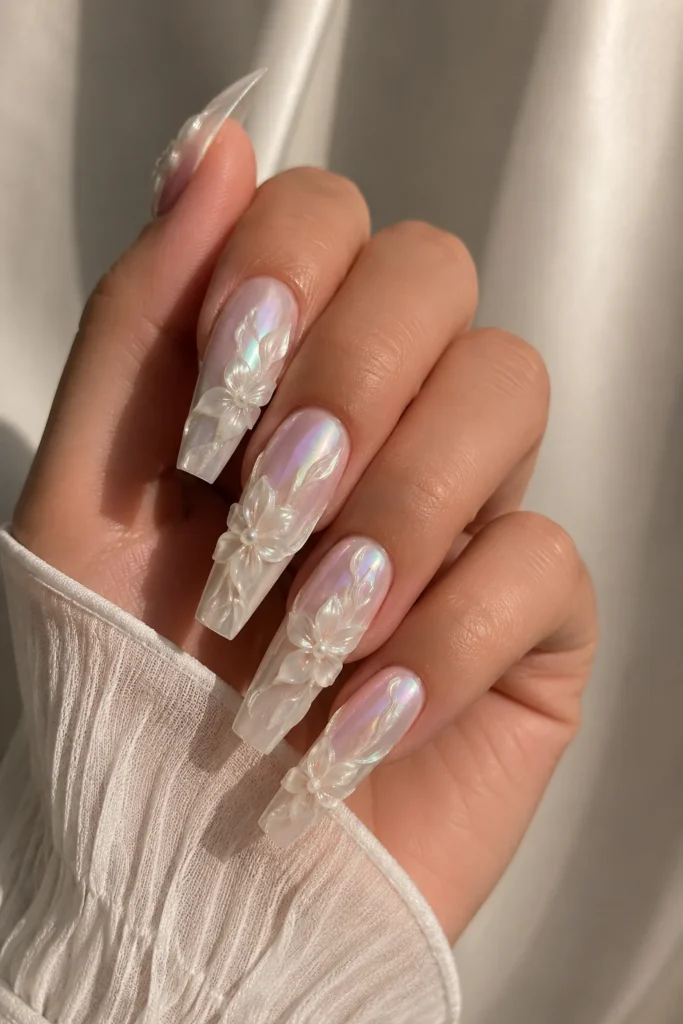 Pearl chrome flower nails with iridescent base and raised white blooms