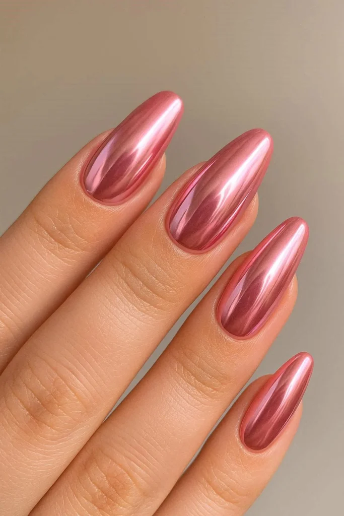 Pink chrome acrylic nails with mirror-like metallic finish