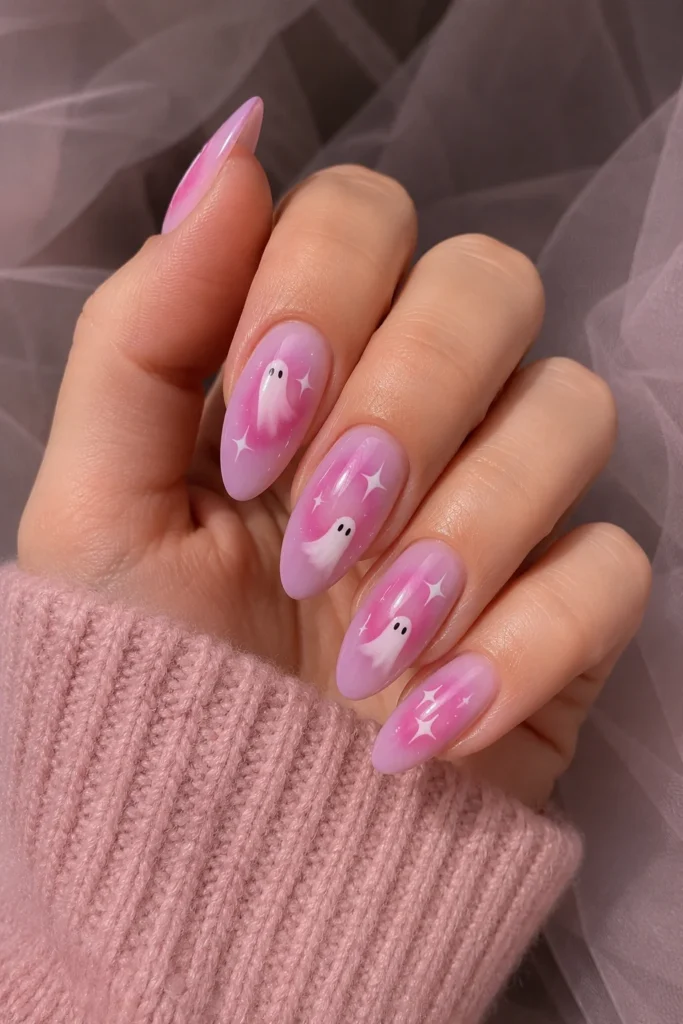 Pink ghost aura nails with glowing gradient and ghost silhouettes