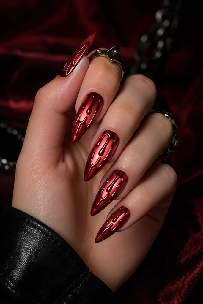 Silver chrome nails with glossy blood red drip art 