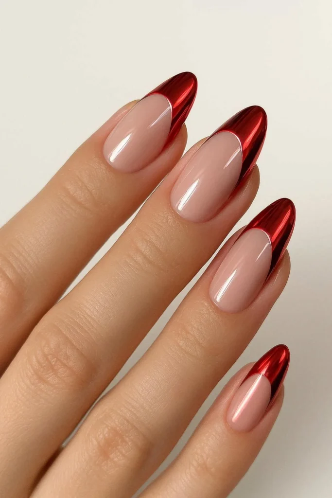 Reflective red chrome candy cane French tip nails holiday glamour