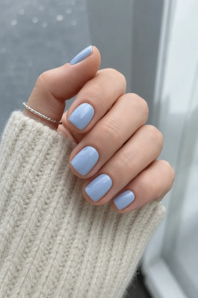 Simple short nails with a soft icy blue winter polish