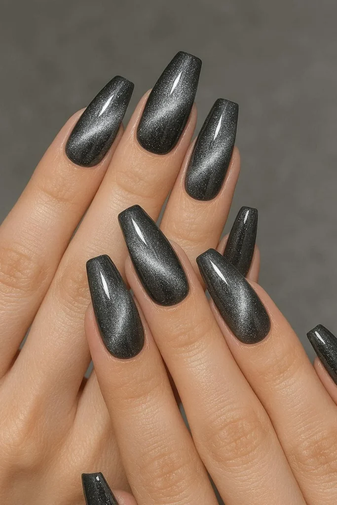 Silver galaxy cat eye nails with stardust shimmer on coffin shape