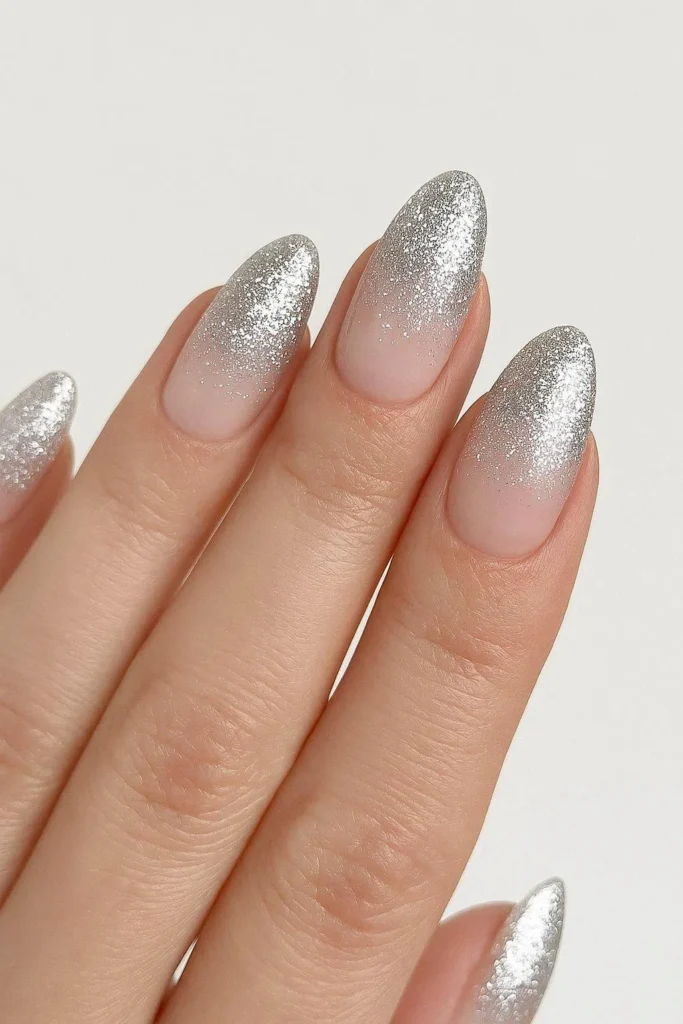 Silver glitter ombre nails with sheer nude base gradient