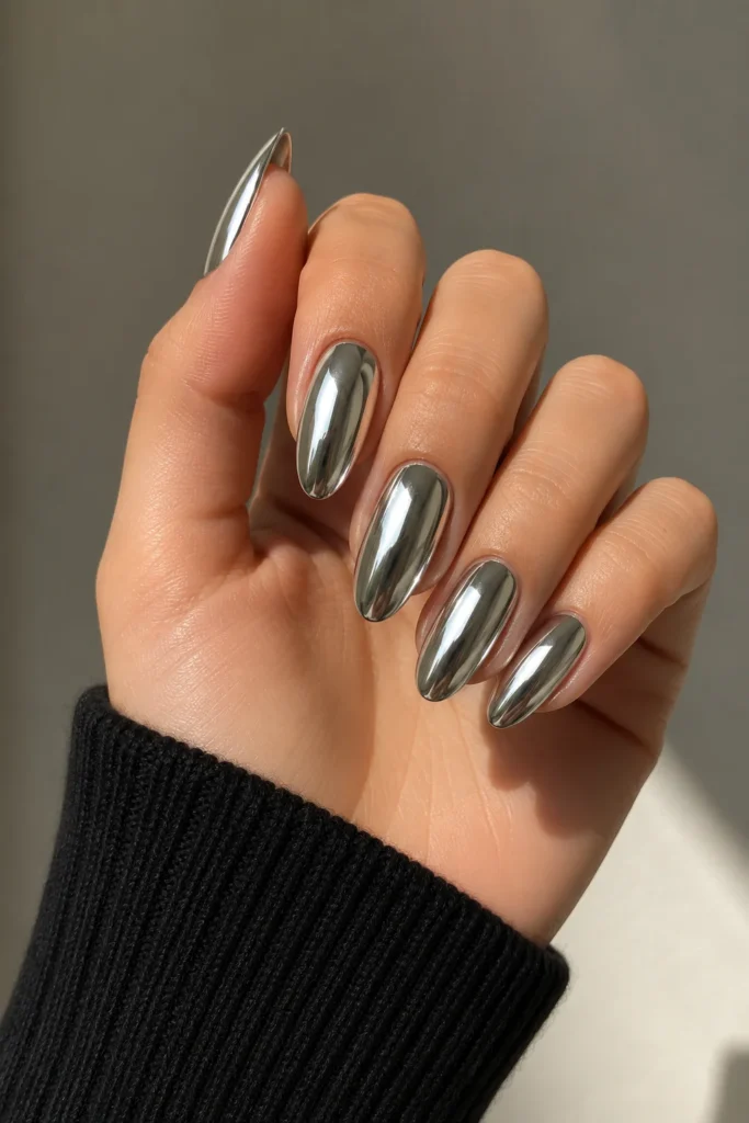 Silver mirror almond chrome nails with ultra-reflective metallic finish
