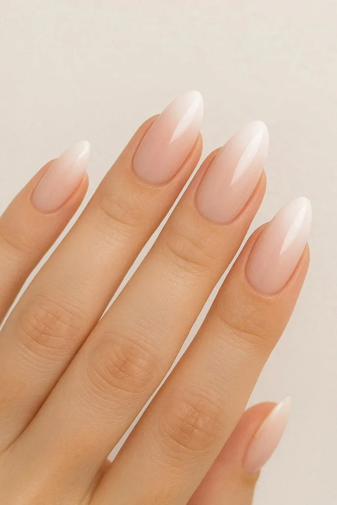 Soft ombre bridesmaid nails nude to white gradient elegant design