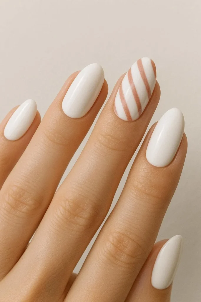 White Christmas nails with subtle candy cane stripe accents