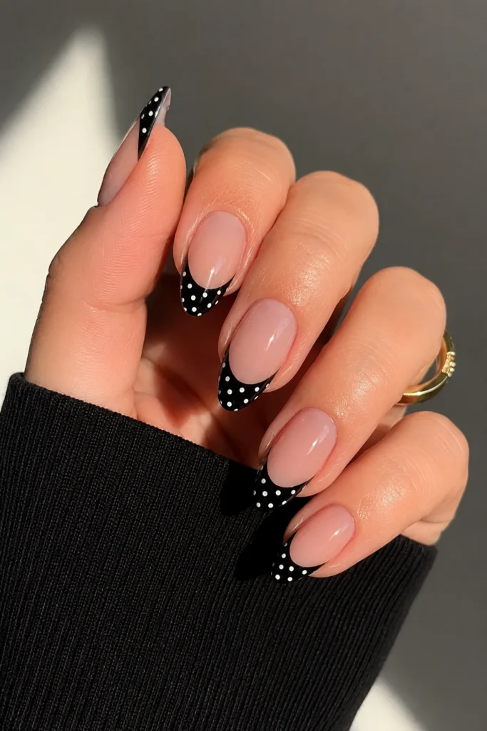 Black French tip nails with white polka dots