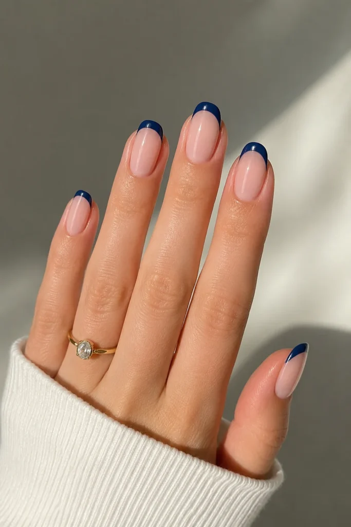 French manicure updated with navy blue tips