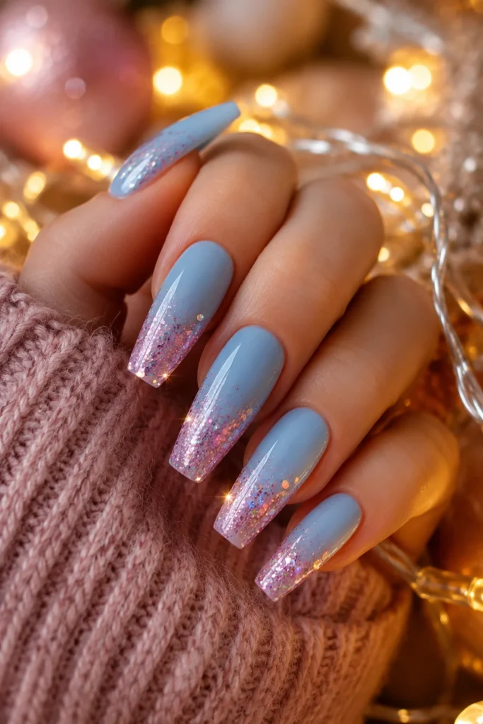 Soft blue nails with pink glitter gradient tips