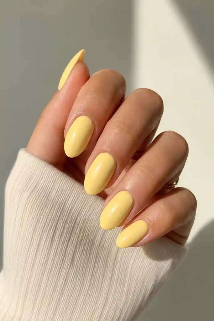 Soft butter yellow nails inspired by spring sunshine