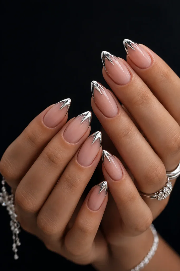 Chrome silver star French tip nail design on nude base