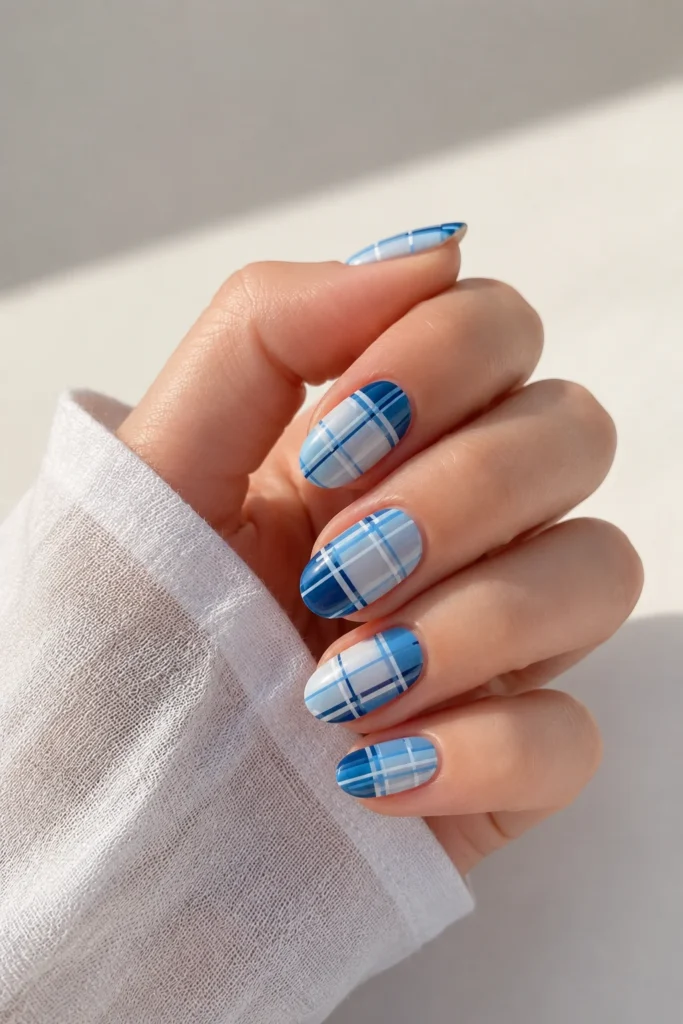 Coastal blue and white plaid nails with glossy finish