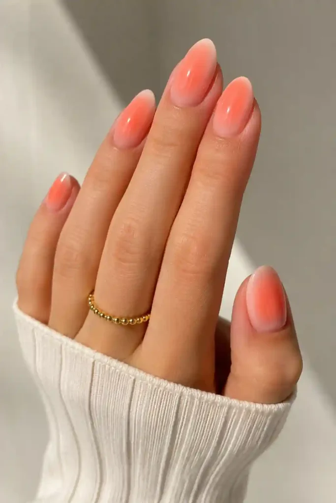 Fresh coral aura nails glowing spring sunshine manicure