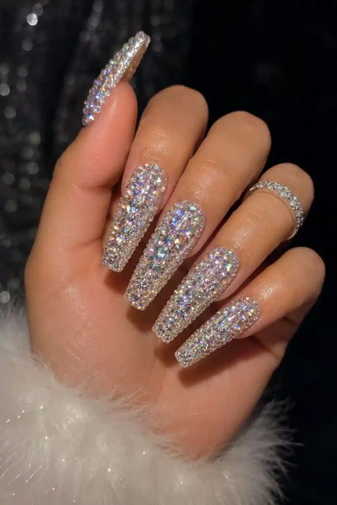 Long coffin nails fully covered in sparkling crystals