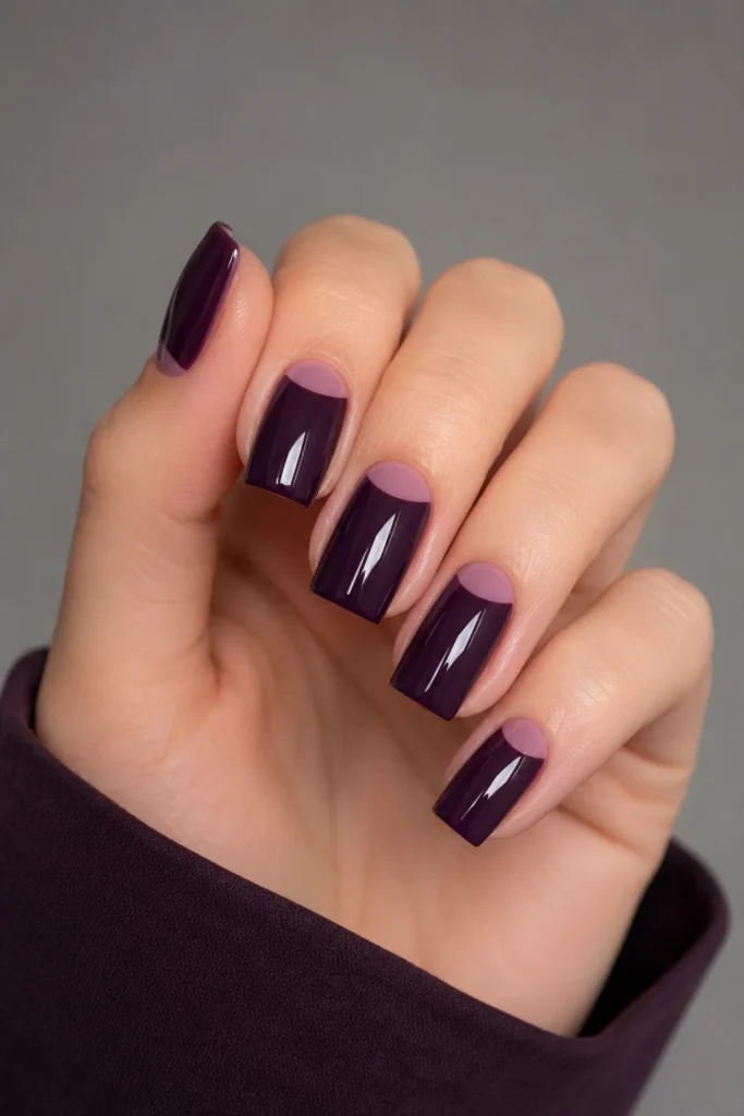 Deep purple nails with pink outlined negative space half-moon
