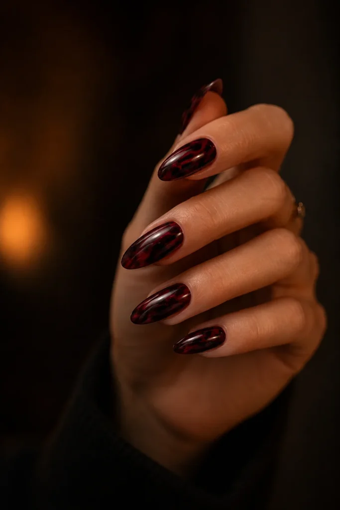Deep wine red marble nail design