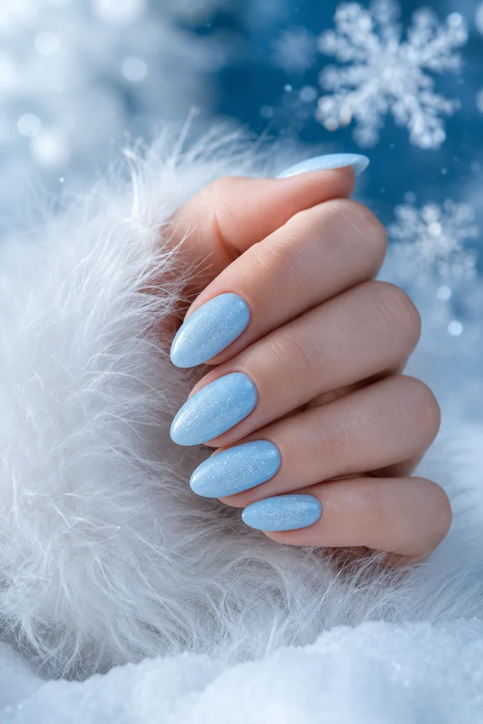Icy blue dip powder nails for winter.