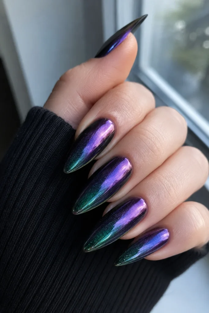 Duochrome pointy nails shifting between purple green and blue tones