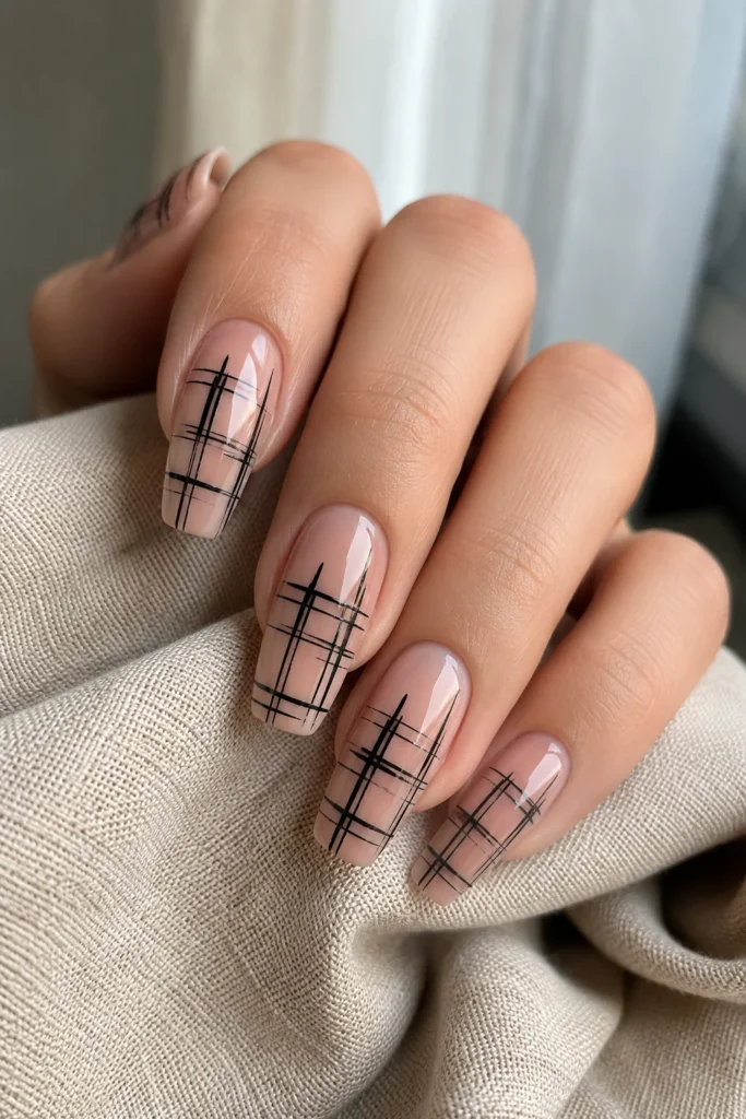 Fine line brush nail art on sheer nude base