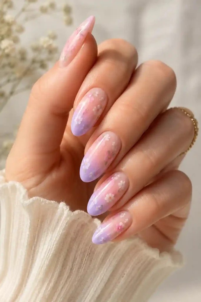 Soft floral ombre nails with pastel gradient and flower accents