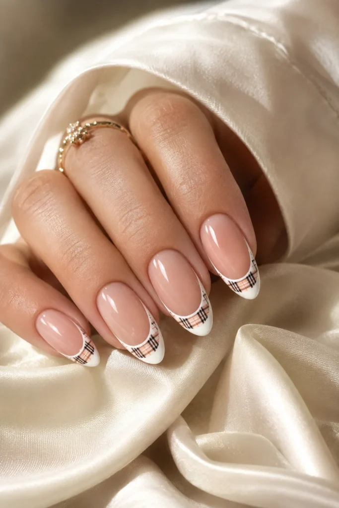 French tip nails with subtle plaid pattern inside tips